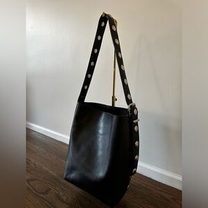 Madewell essential bucket bag - black leather with studs.